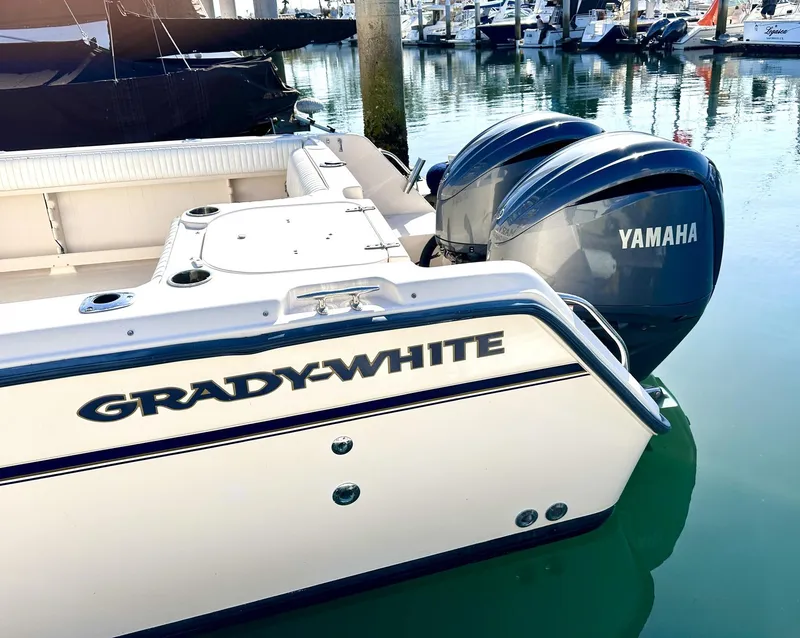 Slide: The Image of 2003 Grady-White Marlin 300 boat with Yamaha engines docked in marina. - 7
