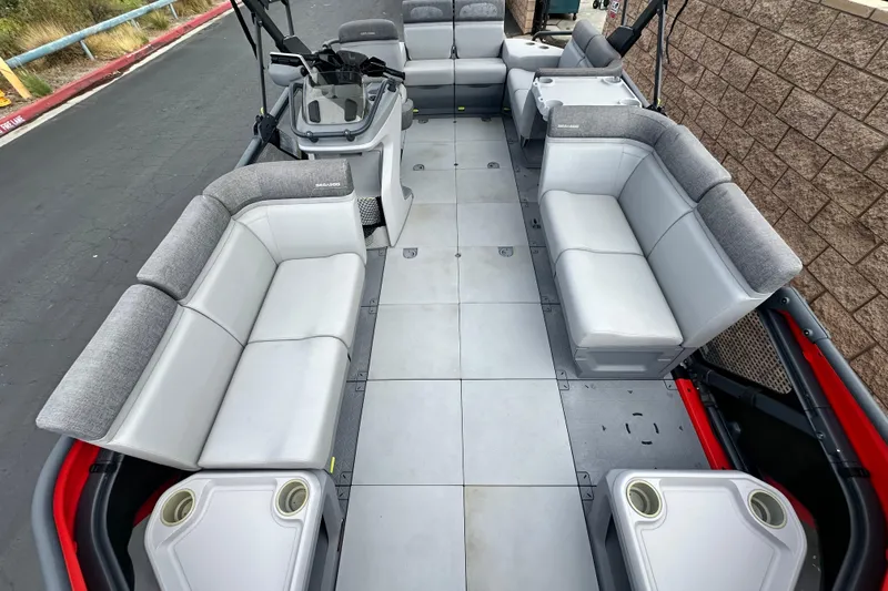 Slide: The Image of 2023 Sea-Doo Switch Cruise 18 interior seating with cup holders, gray upholstery. - 13