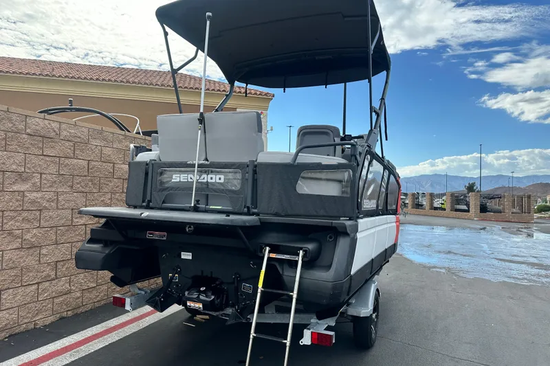 Slide: The Image of 2023 Sea-Doo Switch Cruise 18 on trailer, vibrant red and black design. - 3