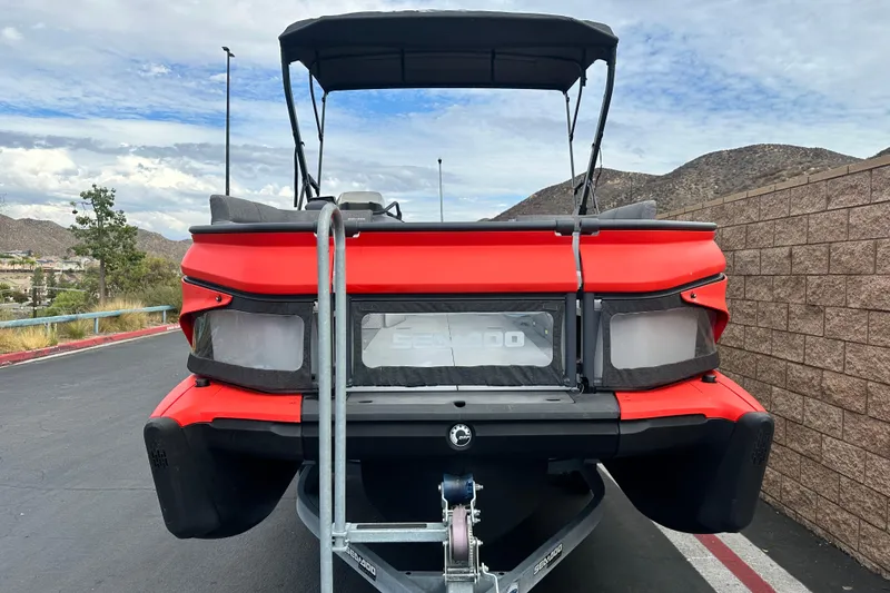 Slide: The Image of 2023 Sea-Doo Switch Cruise 18 interior seating with gray upholstery and cup holder. - 9
