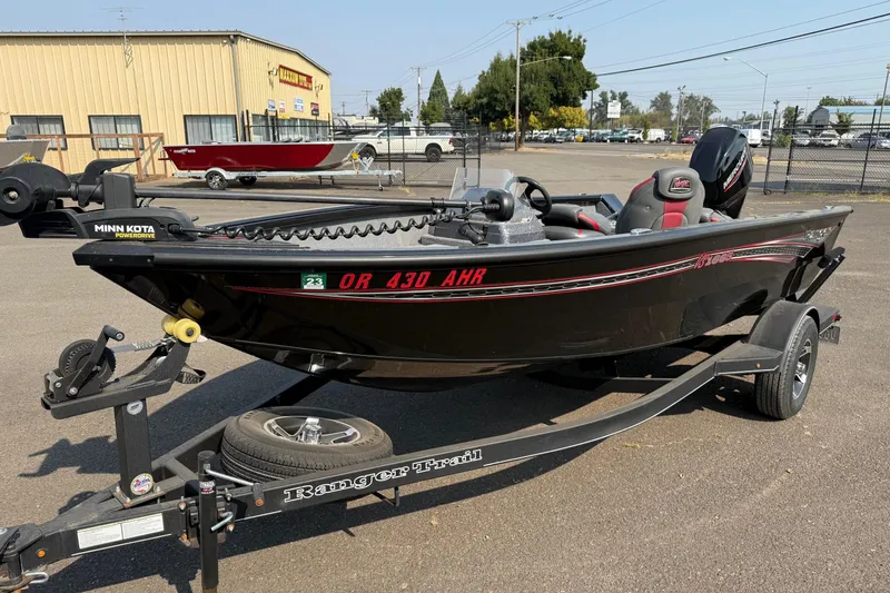 The Image of 2023 Ranger VS1665SC fishing boat on trailer, featuring Minn Kota PowerDrive motor. - 0