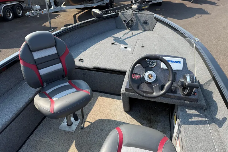Slide: The Image of 2023 Ranger VS1665SC boat interior with steering wheel and seating. - 12