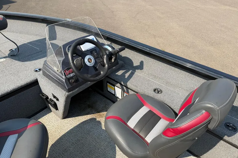Slide: The Image of 2023 Ranger VS1665SC boat interior with steering wheel and seating. - 13
