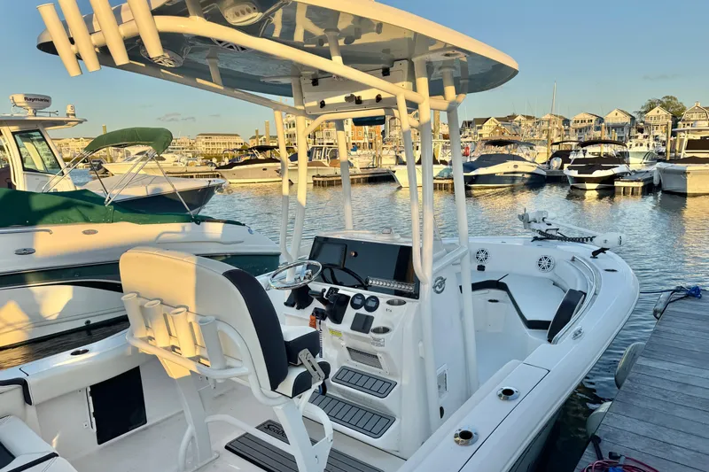 Slide: The Image of 2021 Tidewater 210 LXF boat on trailer, parked outdoors. - 1