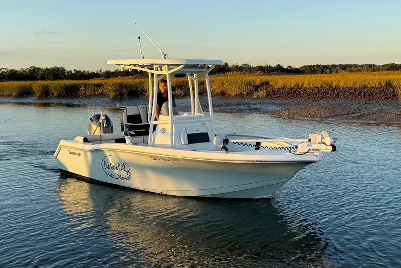 Slide: The Image of 2021 Tidewater 210 LXF boat with Yamaha engine on calm water. - 8