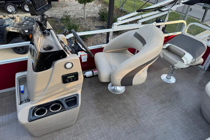 Slide: The Image of 2022 Sun Tracker Bass Buggy 18 DLX interior with steering console and seating. - 5