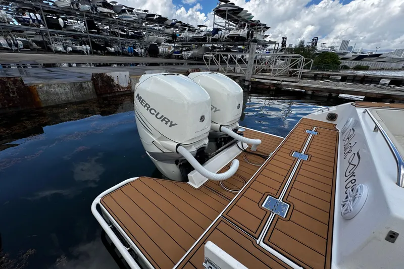 Slide: The Image of 2008 Seaswirl Striper 2901 Walkaround O/B with dual Mercury outboard engines at dock. - 17