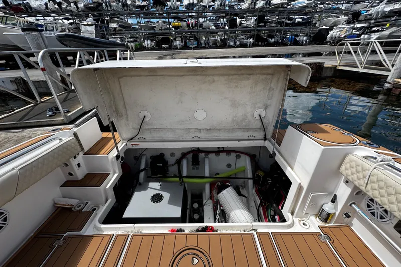 Slide: The Image of 2008 Seaswirl Striper 2901 Walkaround O/B boat with open engine compartment at marina. - 20