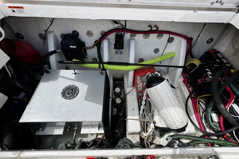 Slide: The Image of 2008 Seaswirl Striper 2901 Walkaround O/B engine compartment with various equipment and wiring. - 21