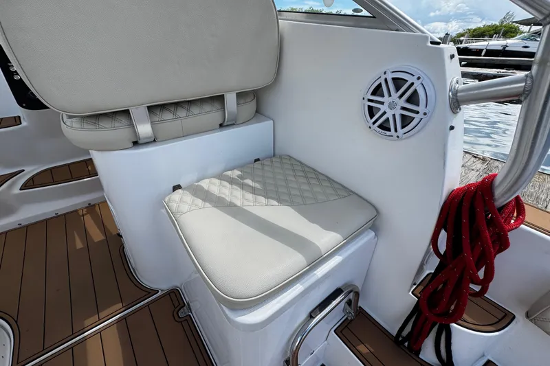 Slide: The Image of 2008 Seaswirl Striper 2901 Walkaround O/B boat interior with cushioned seating and speaker. - 24