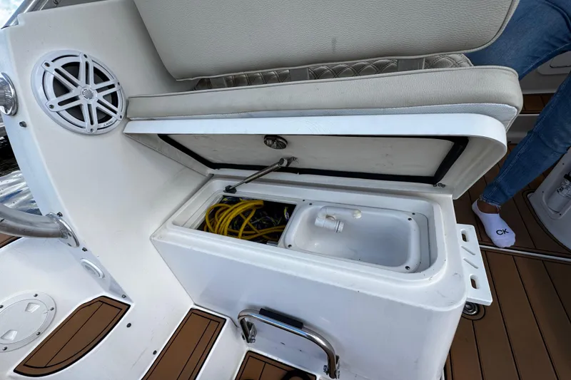 Slide: The Image of 2008 Seaswirl Striper 2901 Walkaround O/B boat storage compartment with open lid and visible wiring. - 25