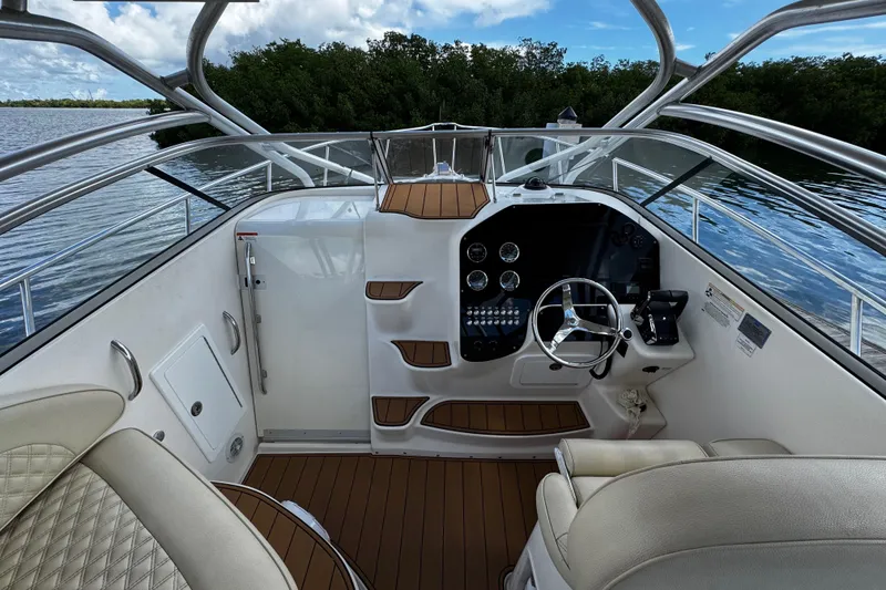 Slide: The Image of 2008 Seaswirl Striper 2901 Walkaround O/B boat cockpit with steering wheel and controls. - 28