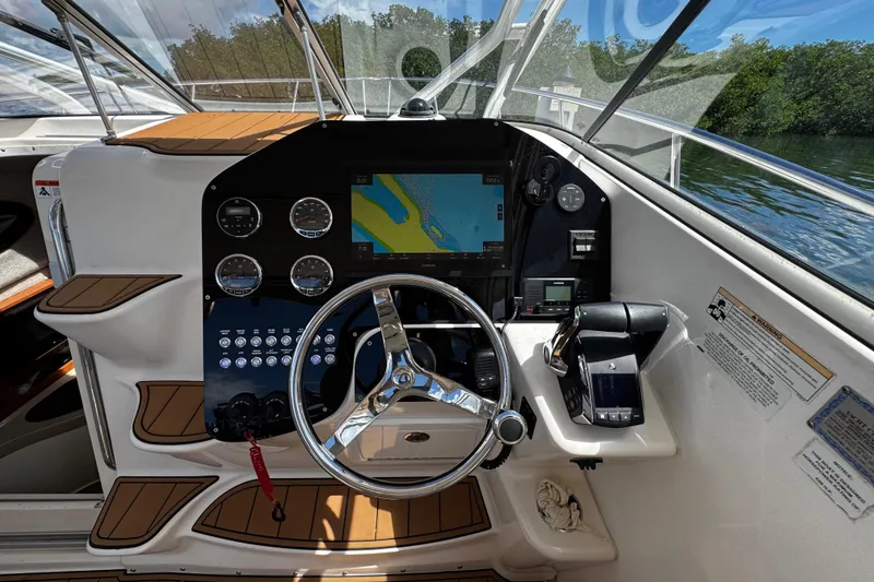 Slide: The Image of 2008 Seaswirl Striper 2901 Walkaround O/B helm with navigation display and controls. - 31