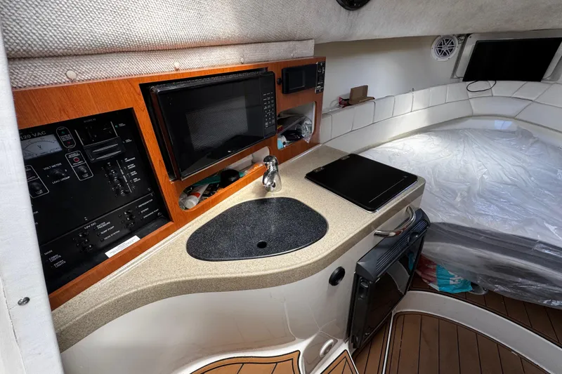 Slide: The Image of 2008 Seaswirl Striper 2901 Walkaround O/B cabin with kitchenette and sleeping area. - 37