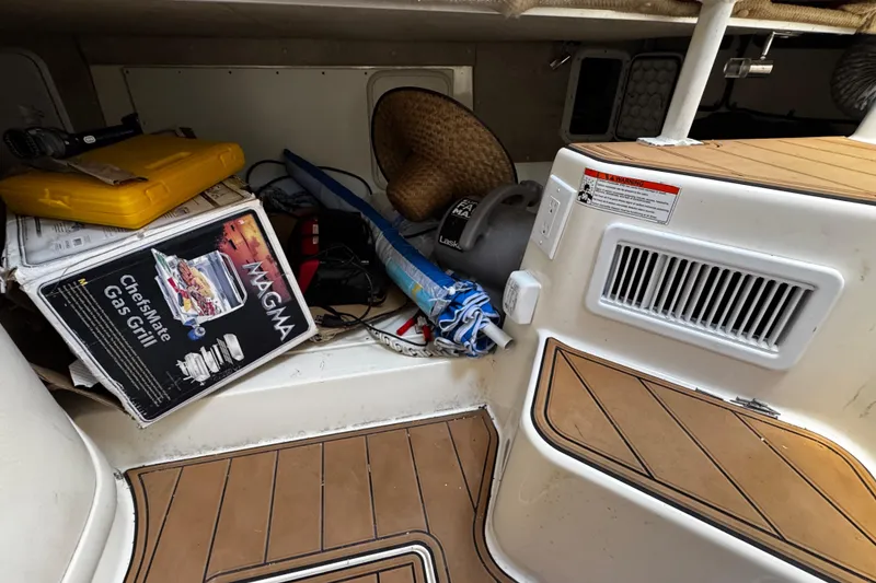 Slide: The Image of Storage area on 2008 Seaswirl Striper 2901 Walkaround O/B with grill and equipment. - 41