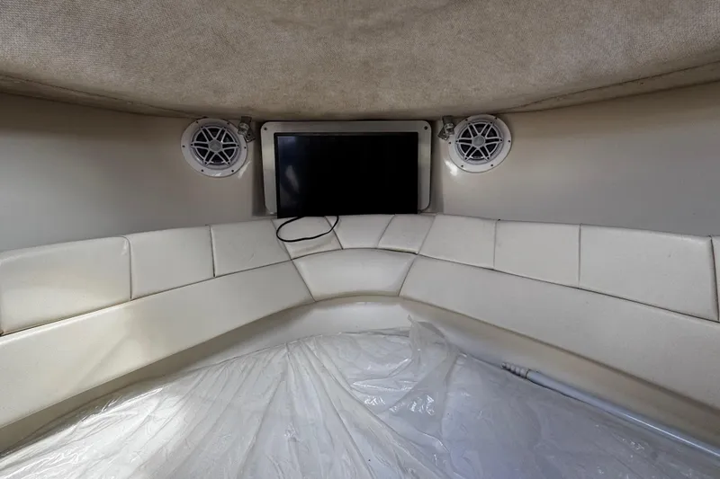 Slide: The Image of 2008 Seaswirl Striper 2901 Walkaround O/B cabin interior with speakers and TV. - 43