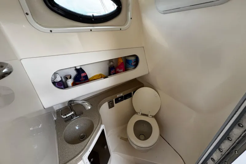 Slide: The Image of 2008 Seaswirl Striper 2901 Walkaround O/B boat bathroom with sink and toilet. - 47