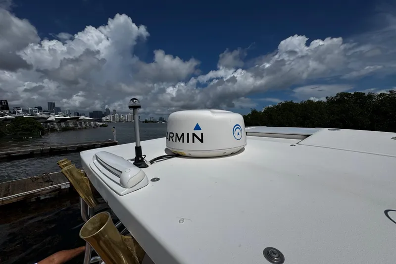 Slide: The Image of 2008 Seaswirl Striper 2901 Walkaround O/B with Garmin radar, docked under cloudy sky. - 51