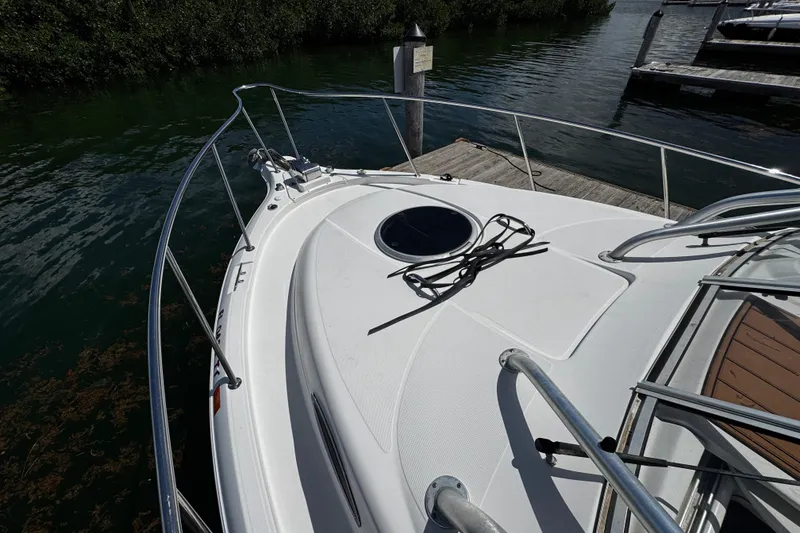 Slide: The Image of 2008 Seaswirl Striper 2901 Walkaround O/B docked, showcasing bow and railing. - 55