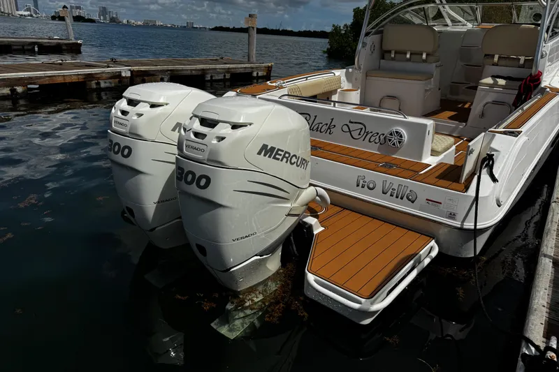 Slide: The Image of 2008 Seaswirl Striper 2901 Walkaround O/B with twin Mercury 300 engines docked by the water. - 8