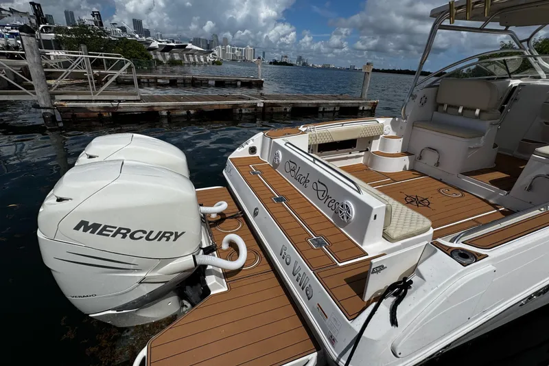 Slide: The Image of 2008 Seaswirl Striper 2901 Walkaround O/B docked with twin Mercury outboard engines. - 9