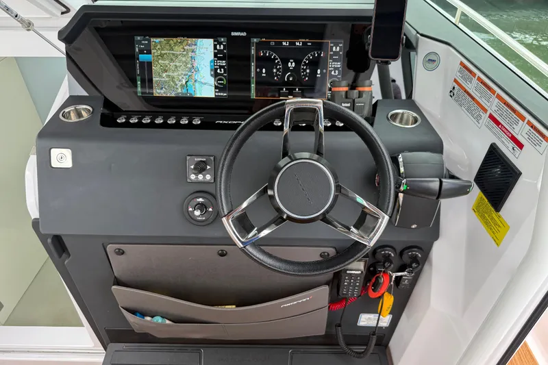 Slide: The Image of 2024 Axopar 37 Sun Top helm with modern navigation and control systems. - 38