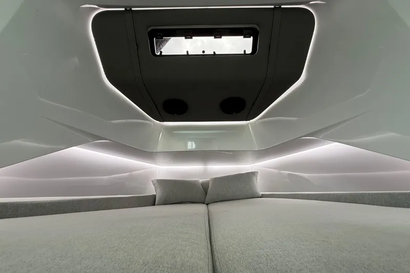 Slide: The Image of Interior cabin of 2024 Axopar 37 Sun Top, featuring modern design and ambient lighting. - 48
