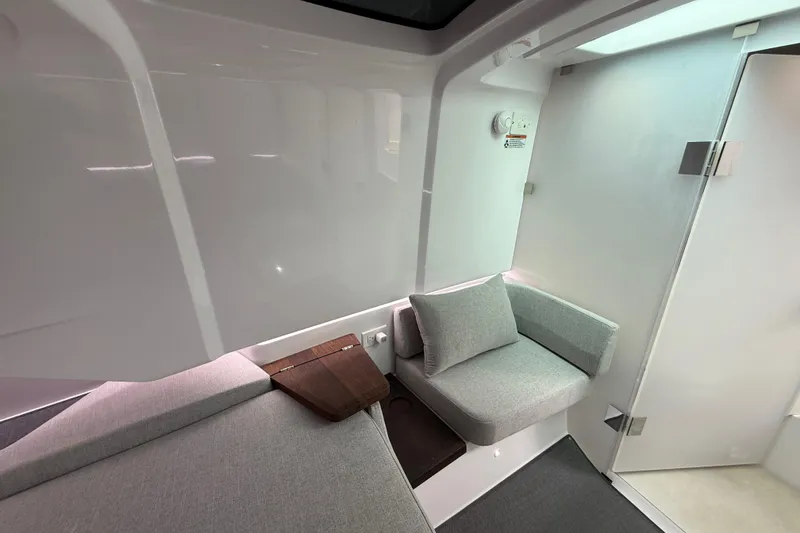 Slide: The Image of Interior of 2024 Axopar 37 Sun Top, featuring modern seating and sleek design. - 49