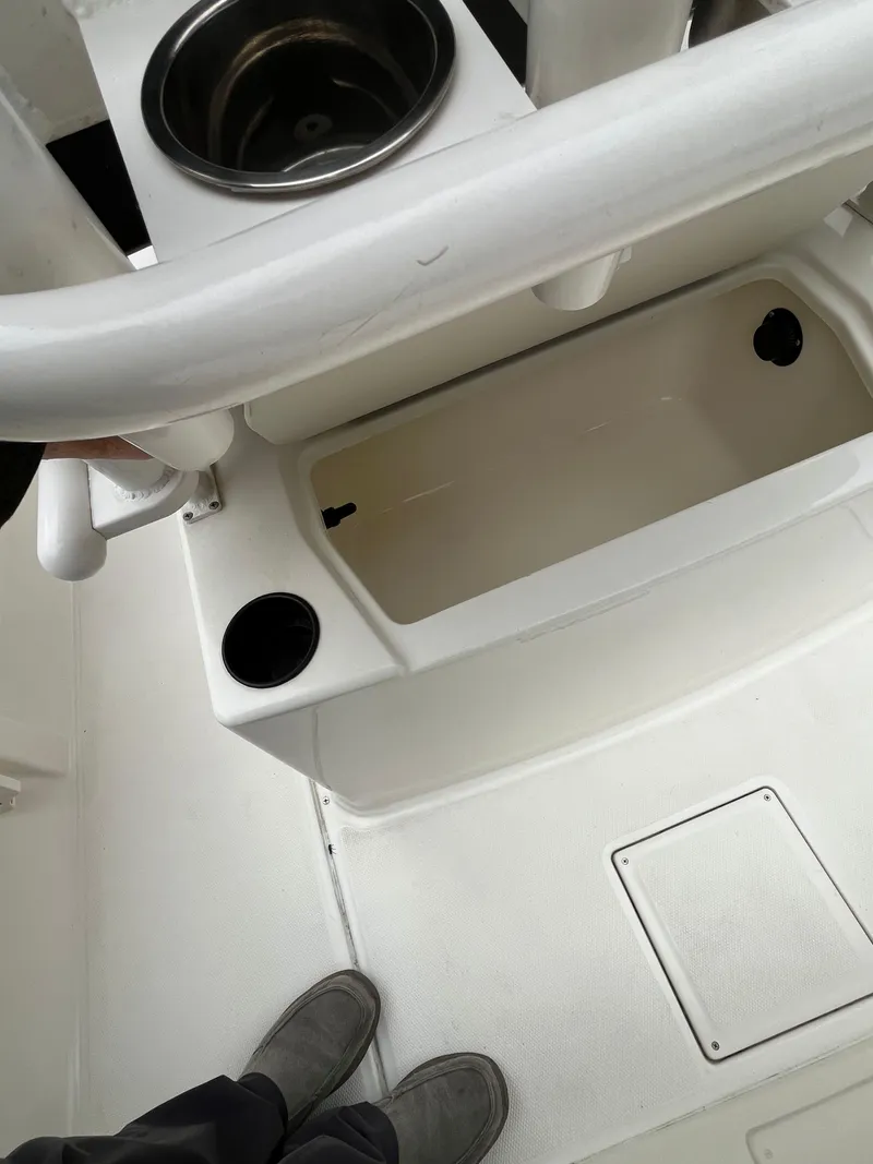 Slide: The Image of 2021 Bayliner Trophy boat interior with sink and storage compartments. - 12