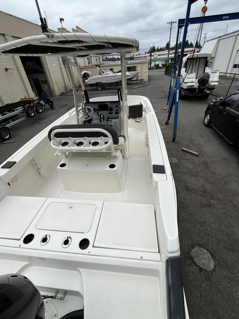 Slide: The Image of 2021 Bayliner Trophy boat with center console, docked in a marina setting. - 14