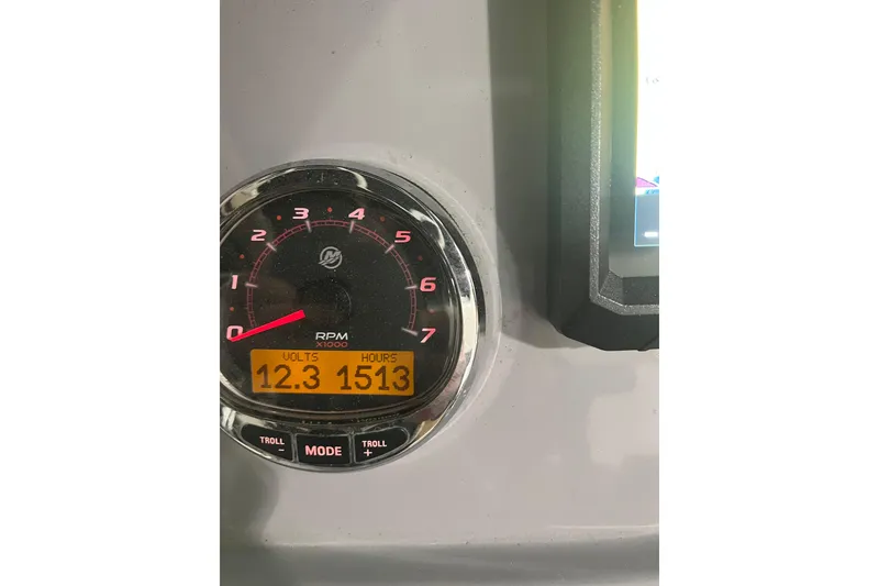 Slide: The Image of Trophy T22 CC 2021 dashboard showing RPM gauge, voltage, and engine hours. - 16