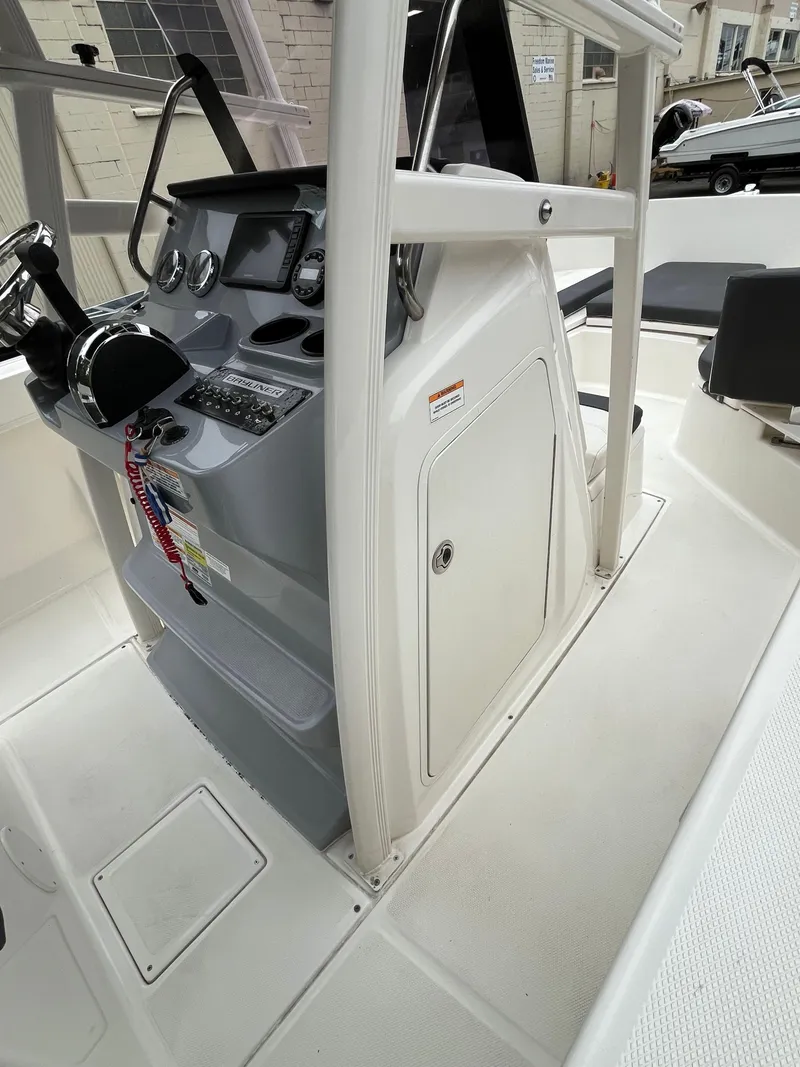 Slide: The Image of 2021 Bayliner Trophy boat cockpit with steering wheel and control panel. - 5