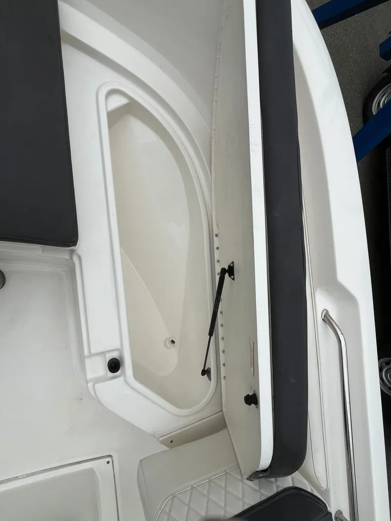 Slide: The Image of 2021 Bayliner Trophy boat interior storage compartment with cushioned seating. - 7