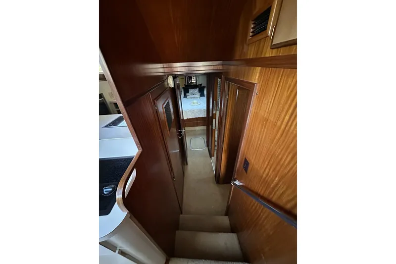 Slide: The Image of Interior of 1988 Hatteras 48 Convertible yacht with modern kitchen and decor elements. - 11