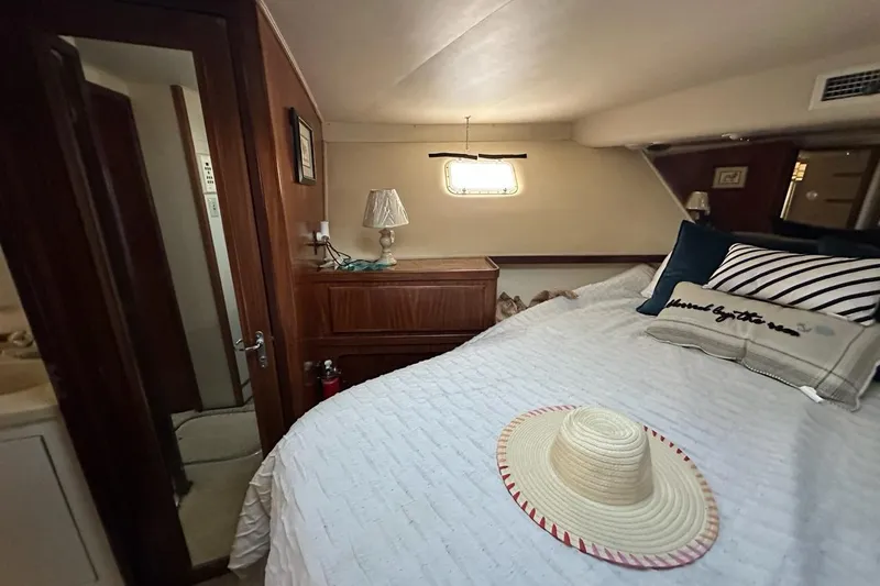 Slide: The Image of 1988 Hatteras 48 Convertible yacht kitchen with modern appliances and wood flooring. - 14