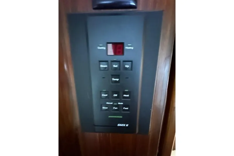 Slide: The Image of Bathroom interior of 1988 Hatteras 48 Convertible yacht, featuring shower, toilet, and sink. - 21