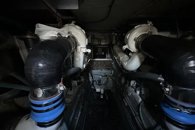 Slide: The Image of Control panel of 1988 Hatteras 48 Convertible boat with warning sign and joystick. - 35