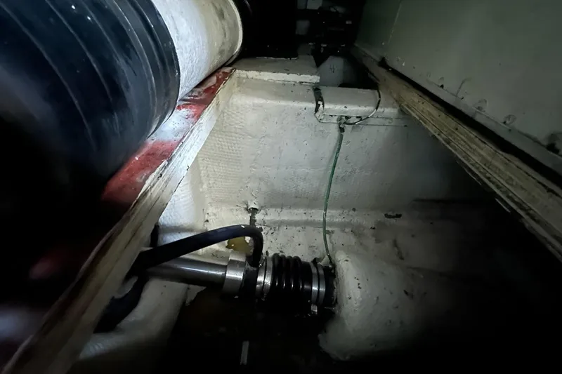 Slide: The Image of 1988 Hatteras 48 Convertible boat interior with white seating and panoramic windows. - 37