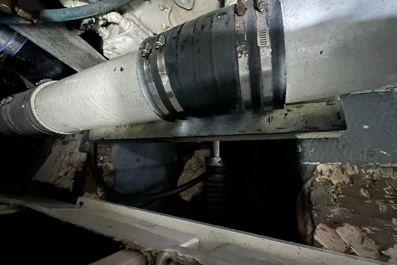 Slide: The Image of Engine compartment of 1988 Hatteras 48 Convertible boat, showing mechanical components and wiring. - 42