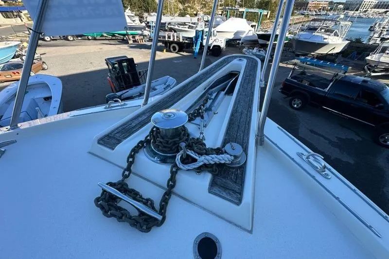 Slide: The Image of Engine room of 1988 Hatteras 48 Convertible yacht, featuring a powerful diesel engine. - 46