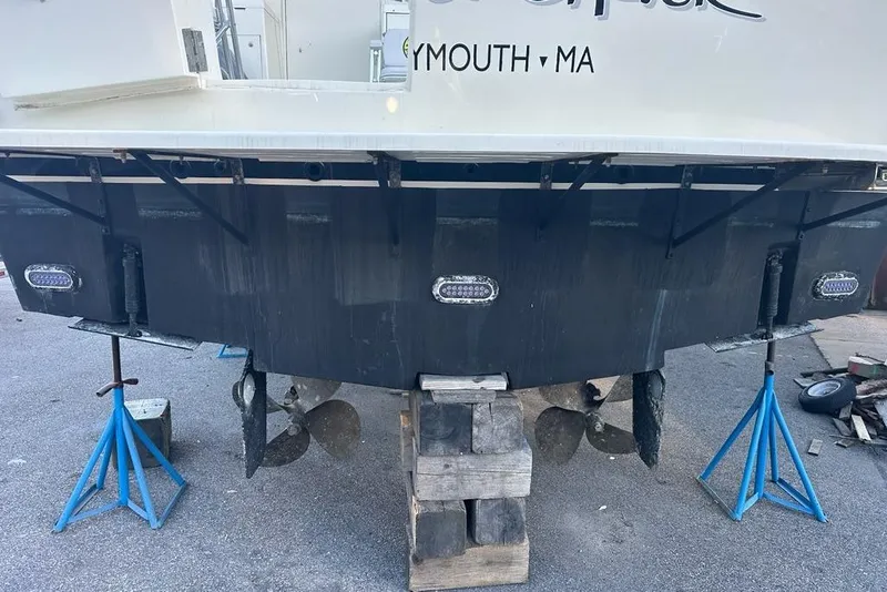 Slide: The Image of Engine room of 1988 Hatteras 48 Convertible, showing pipes and clamps. - 47