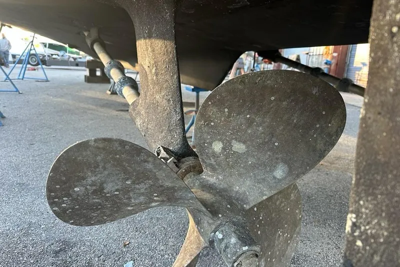 Slide: The Image of Propeller of 1988 Hatteras 48 Convertible boat on dry dock. - 53
