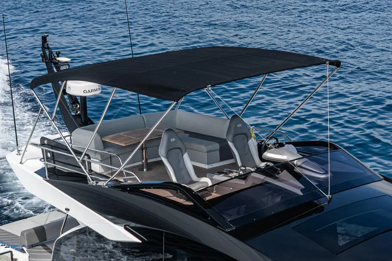 Slide: The Image of 2023 Sunseeker 65 Sport Yacht cruising on open water, featuring sleek design and modern amenities. - 13