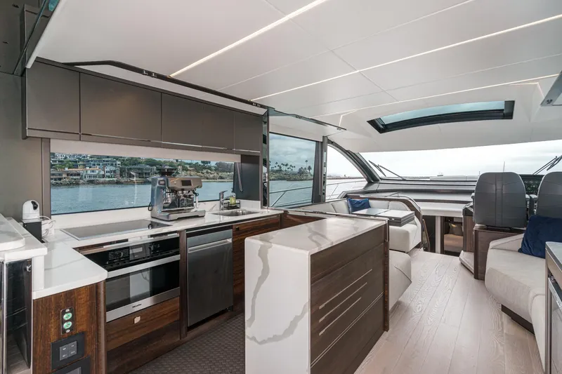 Slide: The Image of Luxurious interior of 2023 Sunseeker 65 Sport Yacht with modern kitchen and seating area. - 24