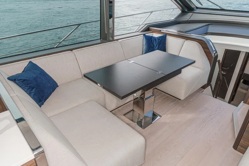 Slide: The Image of Luxurious interior of 2023 Sunseeker 65 Sport Yacht with elegant seating and table. - 30