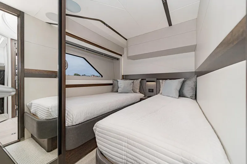 Slide: The Image of Luxurious twin bedroom in 2023 Sunseeker 65 Sport Yacht, featuring modern design and elegant decor. - 45