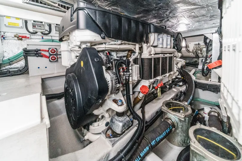 Slide: The Image of Engine room of 2023 Sunseeker 65 Sport Yacht, showcasing advanced mechanical systems. - 54