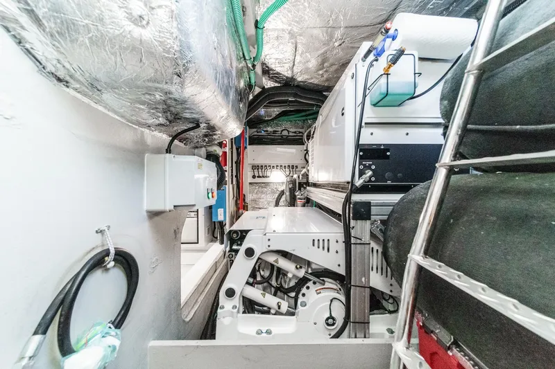 Slide: The Image of Engine room of 2023 Sunseeker 65 Sport Yacht, showcasing advanced mechanical systems. - 57