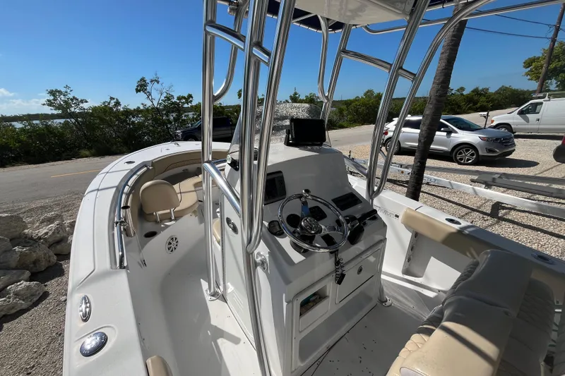 Slide: The Image of 2014 Sportsman Heritage 211 Center Console boat with sleek design and modern controls. - 10