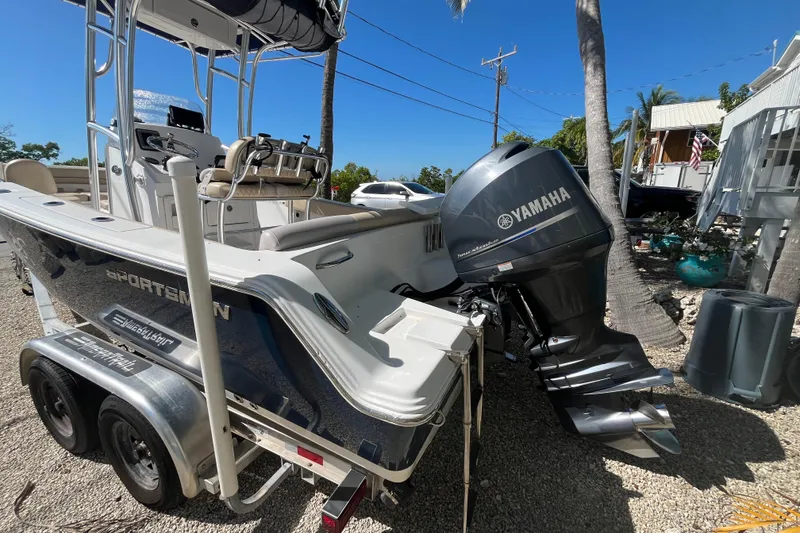 Slide: The Image of 2014 Sportsman Heritage 211 Center Console boat with Yamaha outboard motor on trailer. - 5